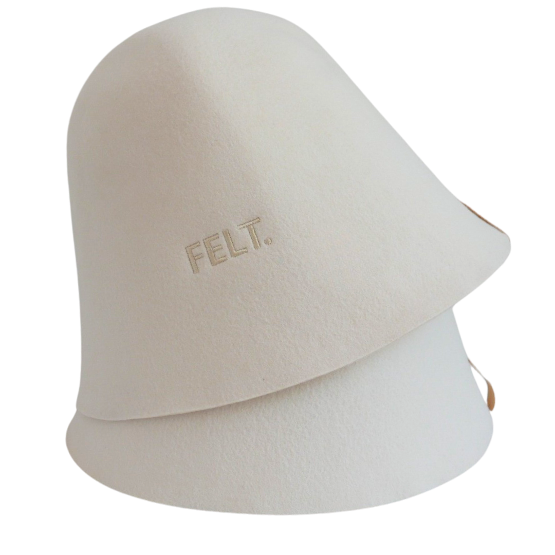 Close-up of two stacked 4mm Australian Merino wool felt The Classic sauna hats showing the embossed FELT. branding