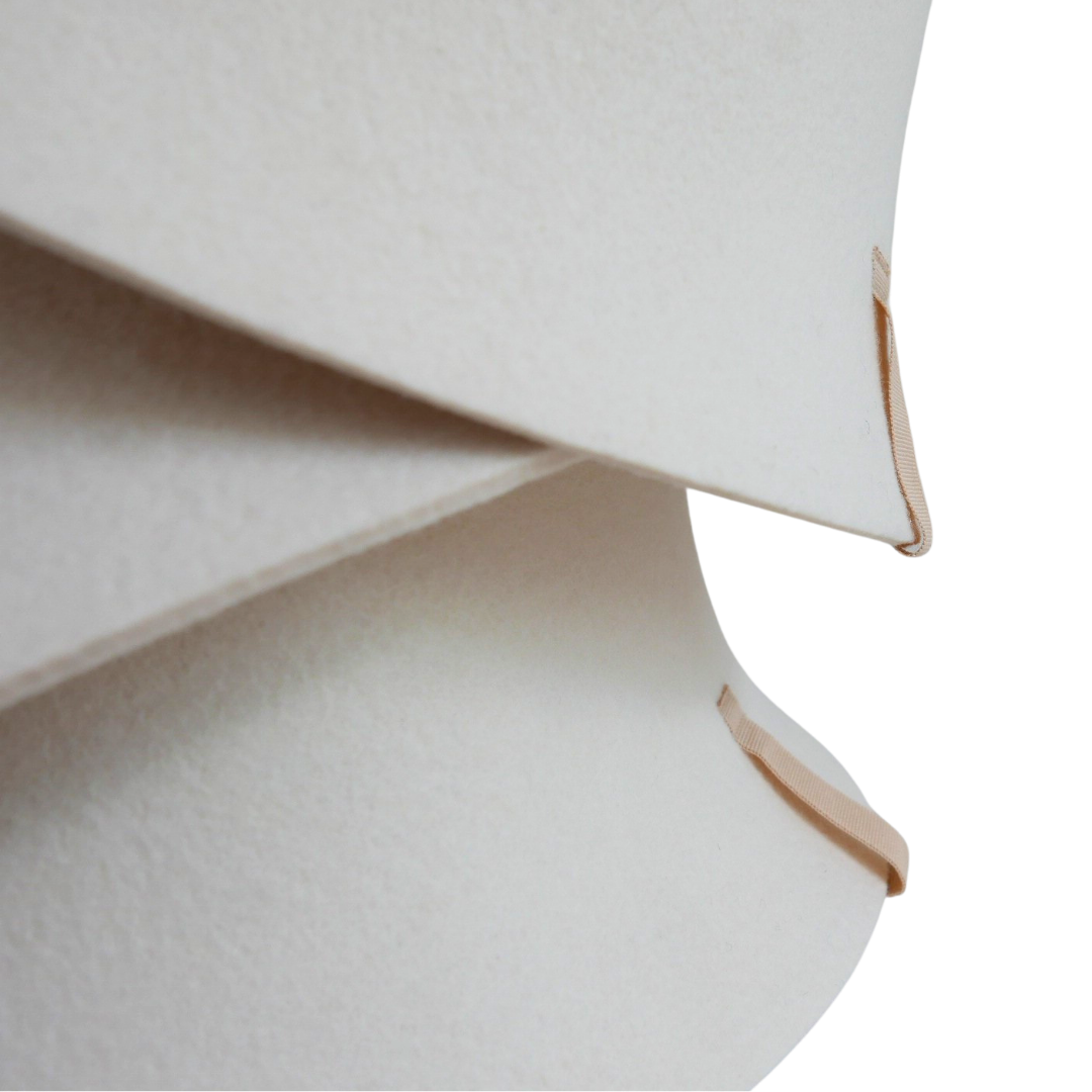 Close-up of the seamless edge construction on a FELT. The Modern merino wool sauna hat